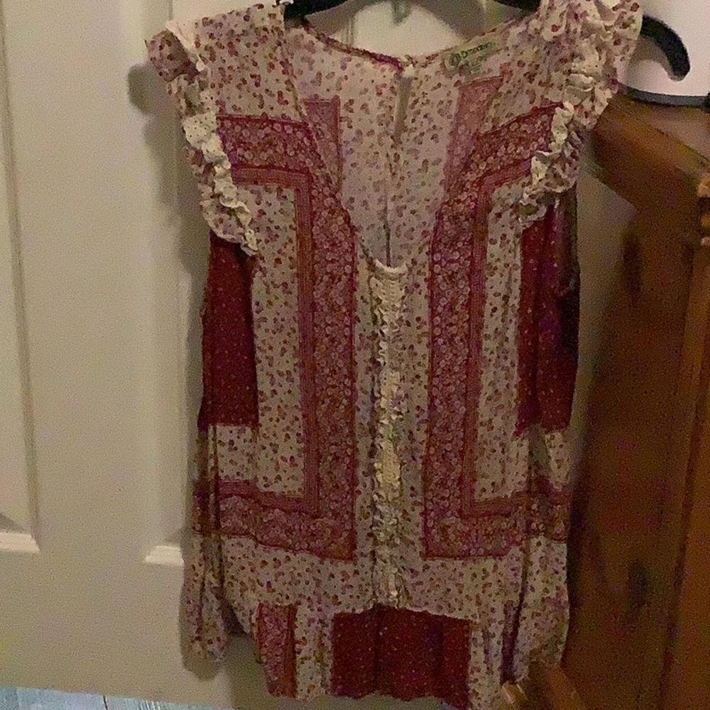 Top red and cream. Short sleeves with ruffles on top